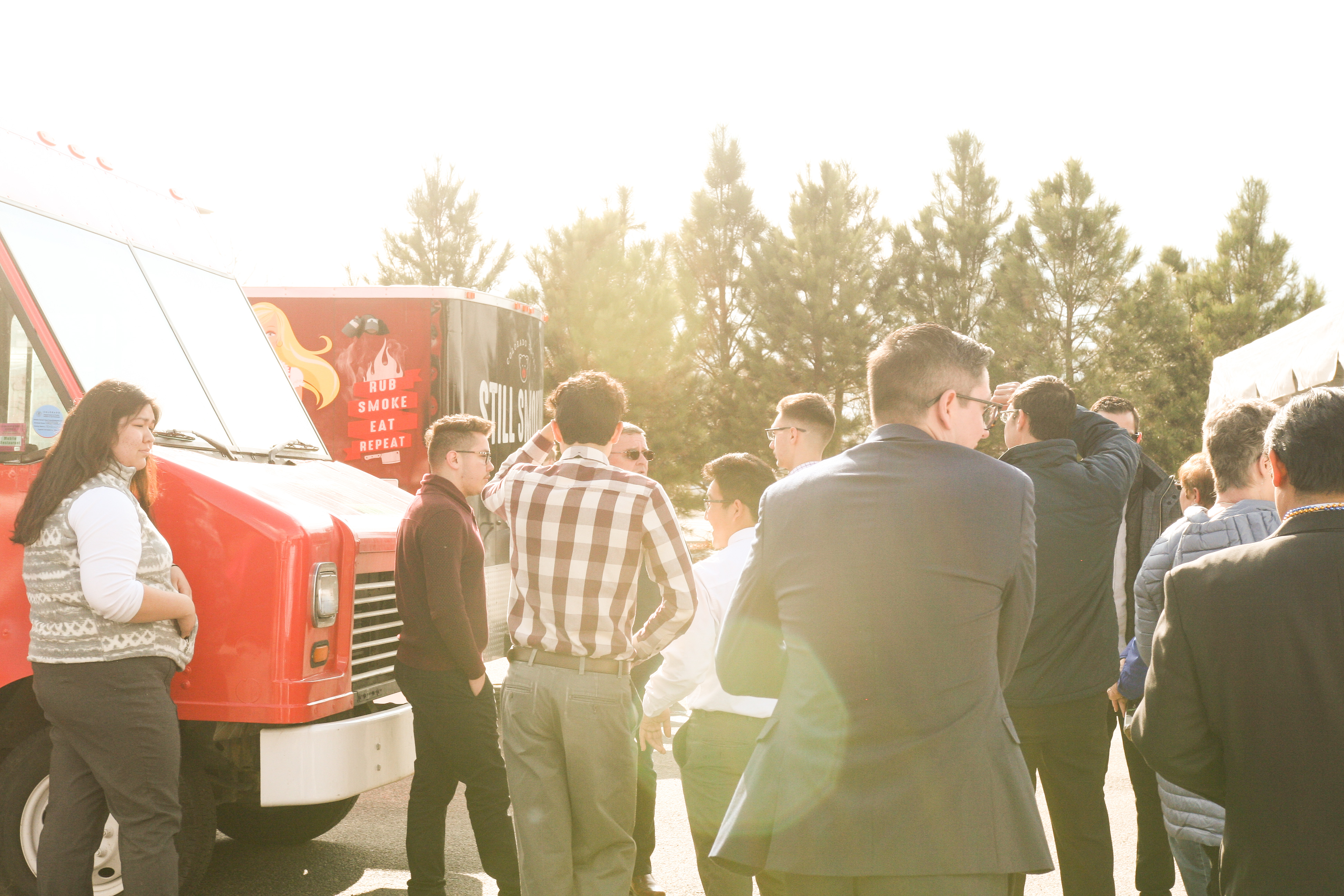 Alumni Matrix Meetup — networking under tents at Regis University